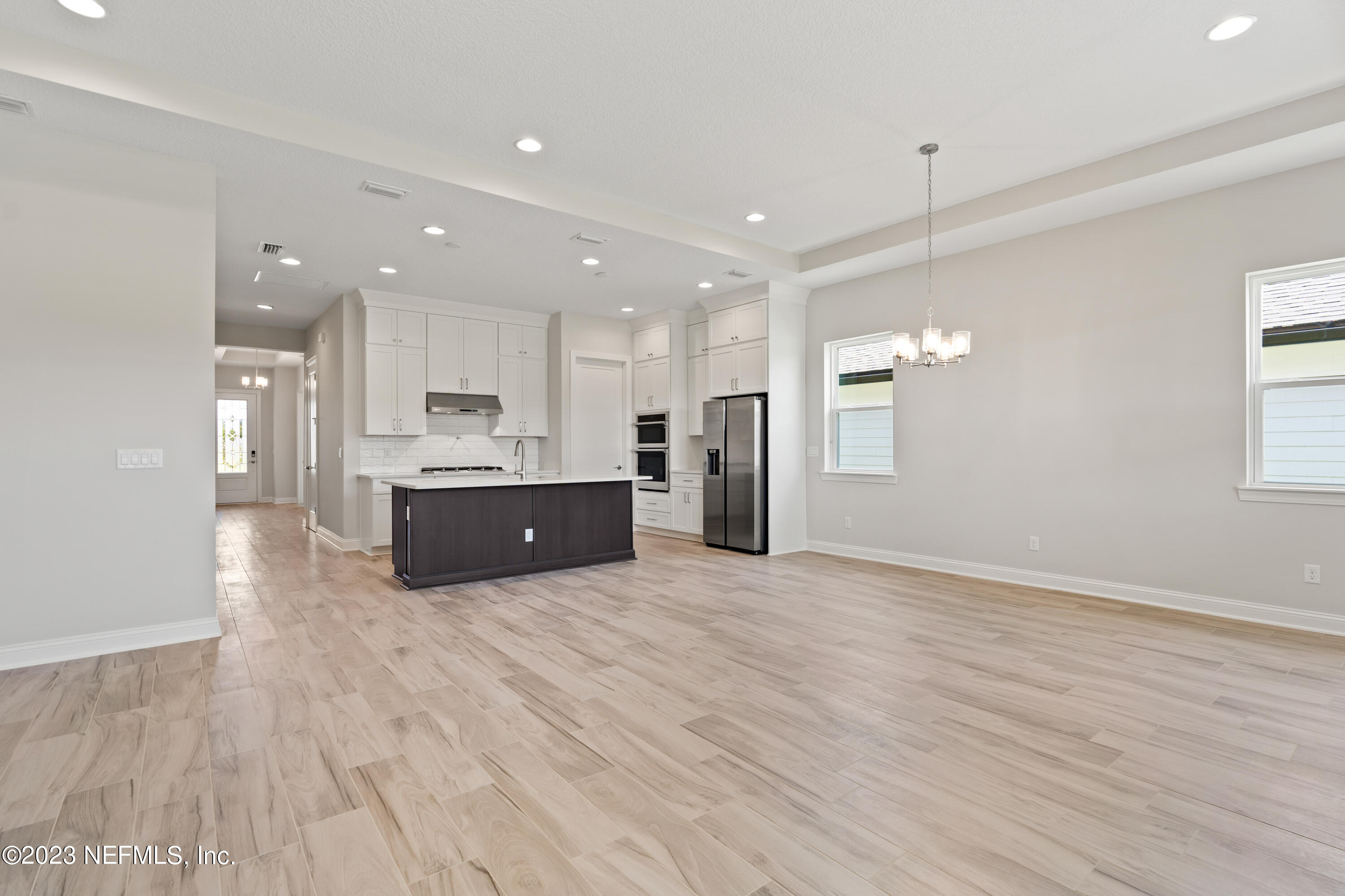 78 Clearview Drive St. Augustine, FL 32092 - Photo 11 of 61 a large kitchen with stainless steel appliances kitchen island a large counter top and a wooden floors