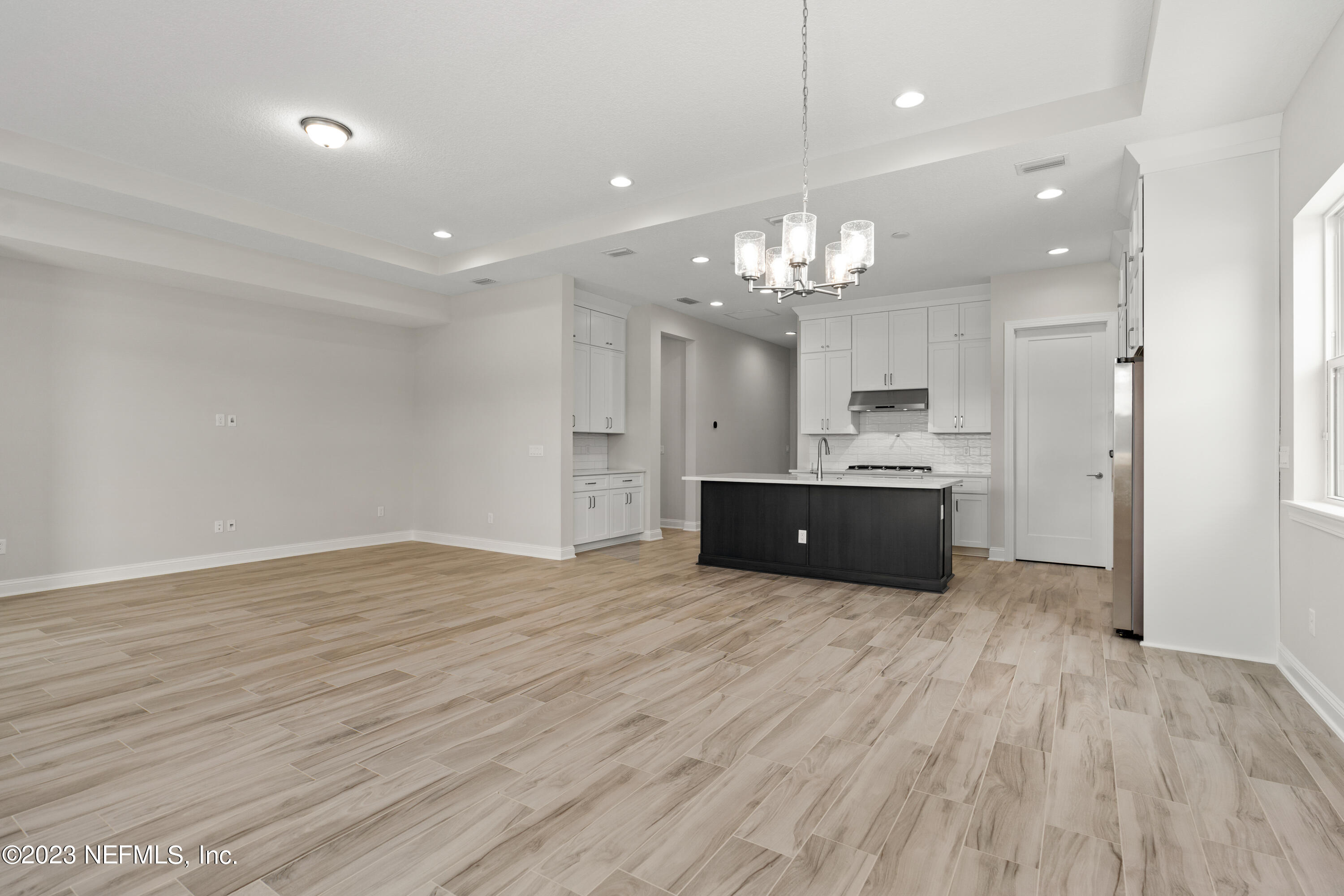 78 Clearview Drive St. Augustine, FL 32092 - Photo 12 of 61 a large kitchen with granite countertop a large counter top a sink stainless steel appliances and cabinets