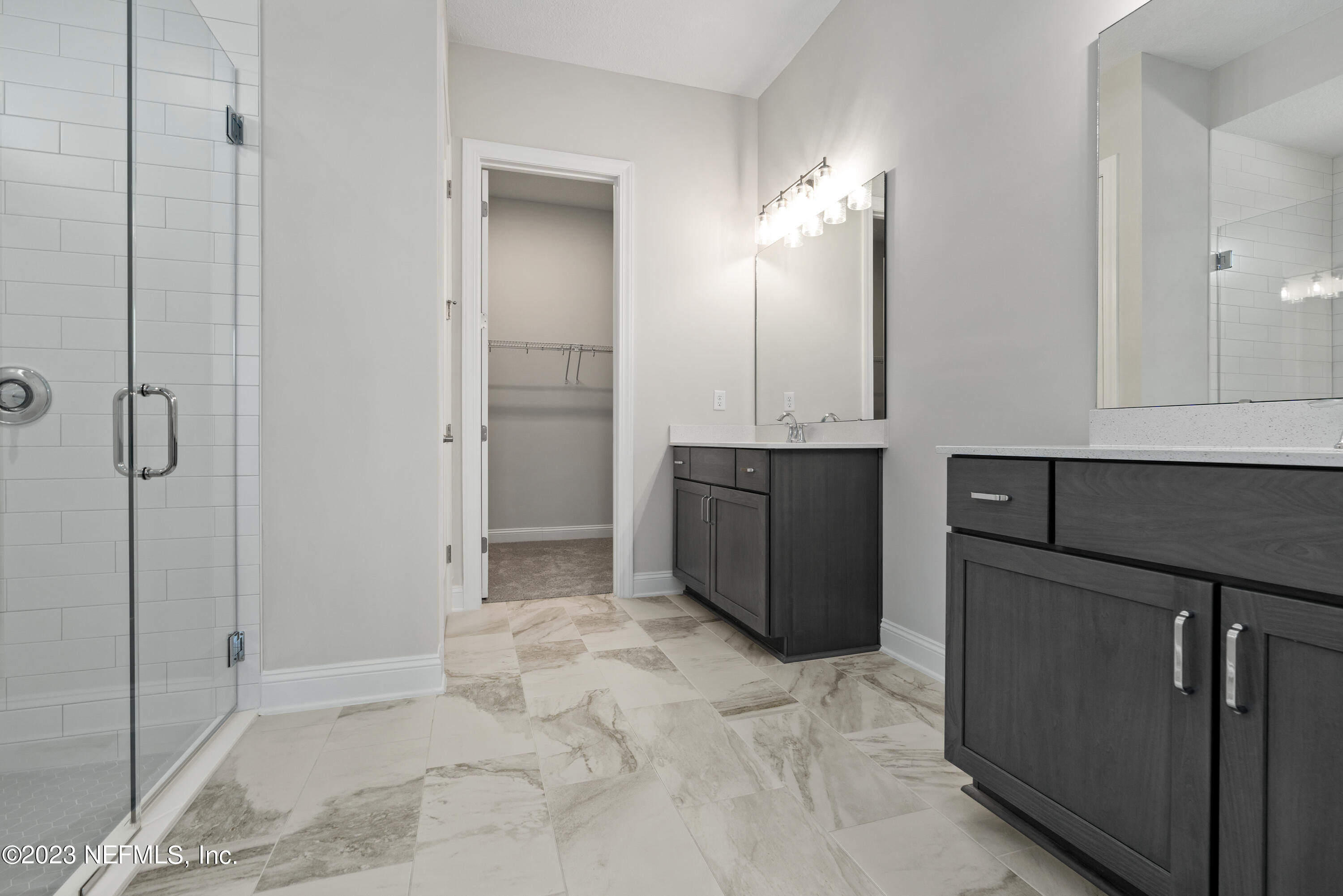 78 Clearview Drive St. Augustine, FL 32092 - Photo 17 of 61 a spacious bathroom with a mirror and a shower