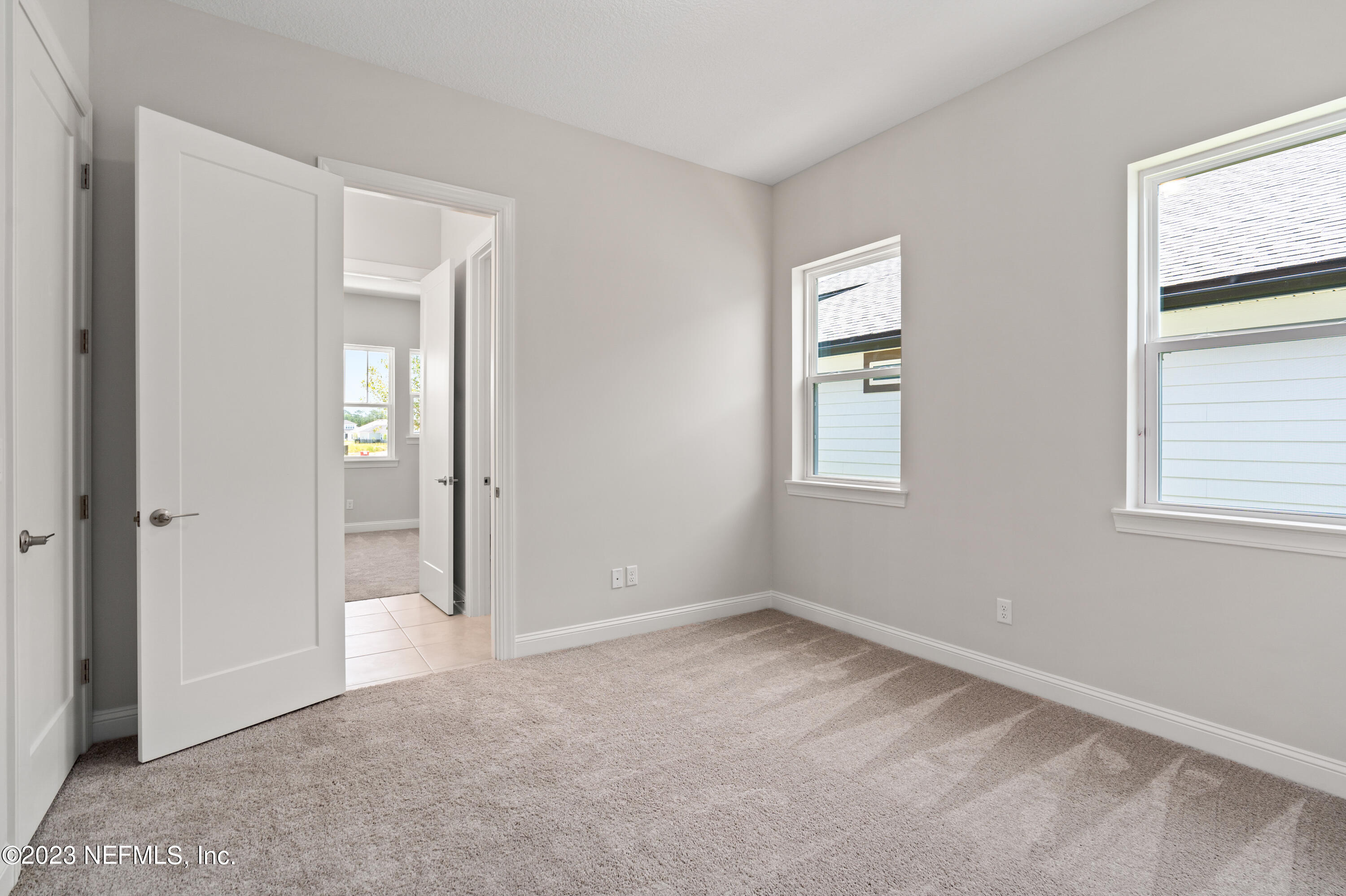 78 Clearview Drive St. Augustine, FL 32092 - Photo 23 of 61 wooden floor and windows in a room