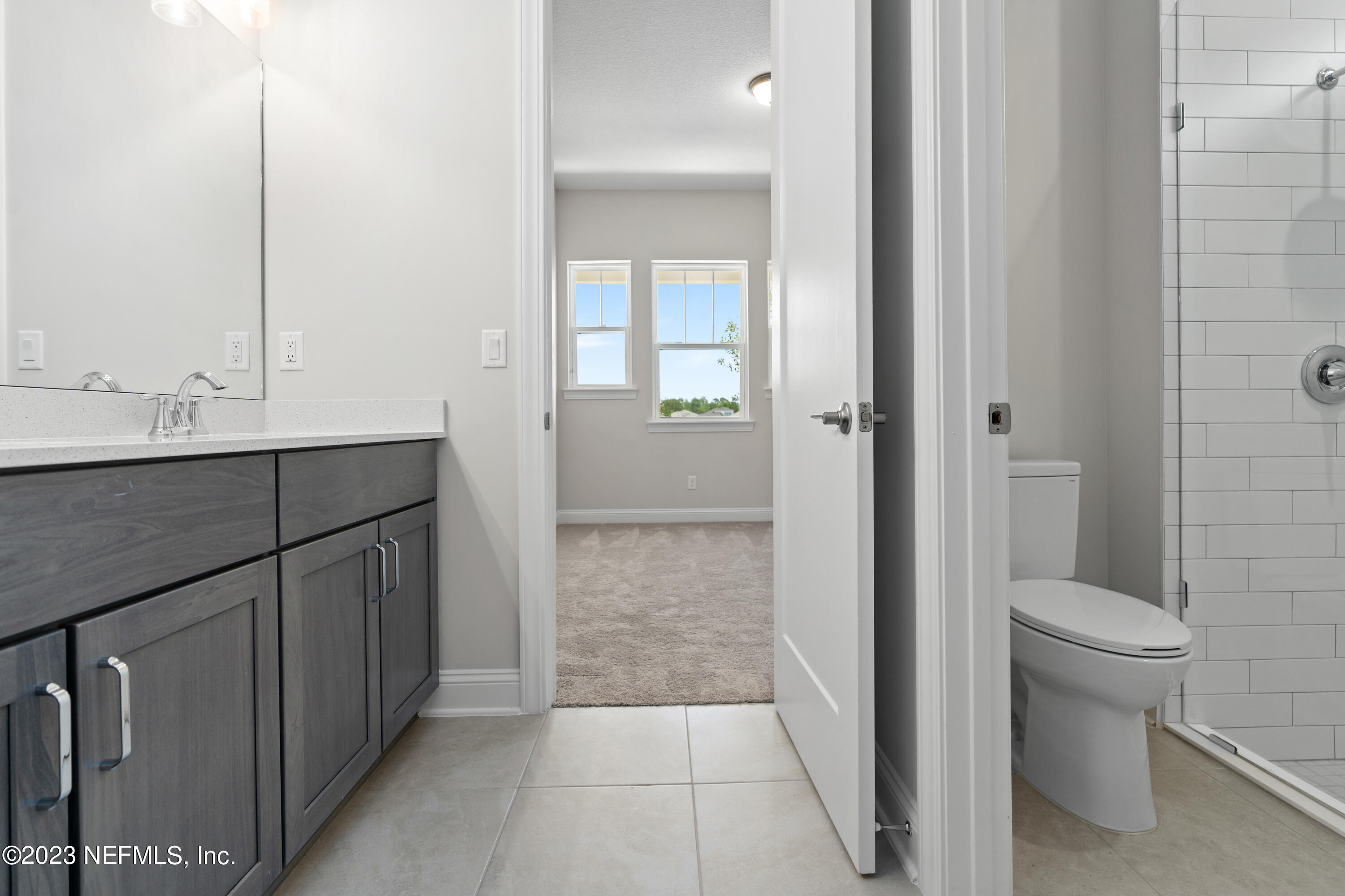 78 Clearview Drive St. Augustine, FL 32092 - Photo 24 of 61 a bathroom with a sink a toilet and shower