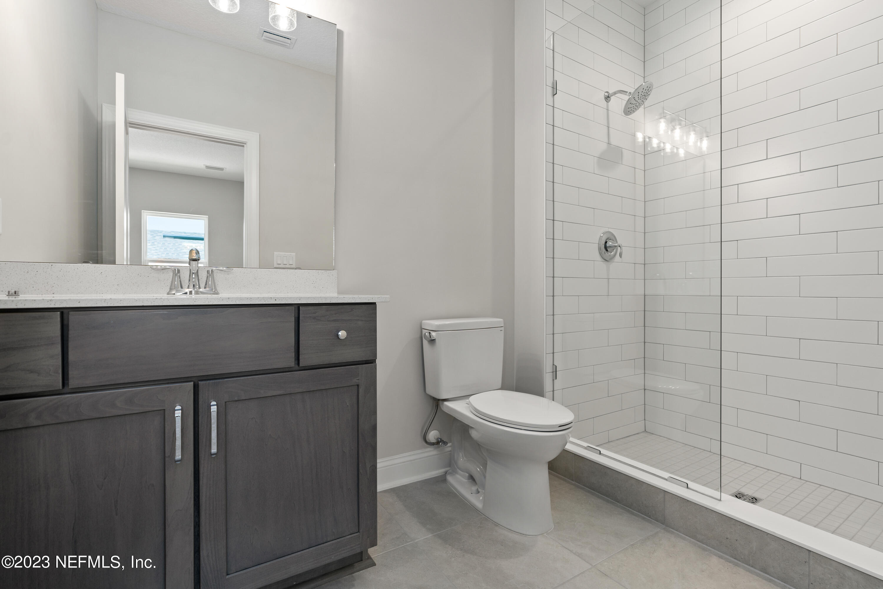 78 Clearview Drive St. Augustine, FL 32092 - Photo 36 of 61 a bathroom with a sink a toilet and shower