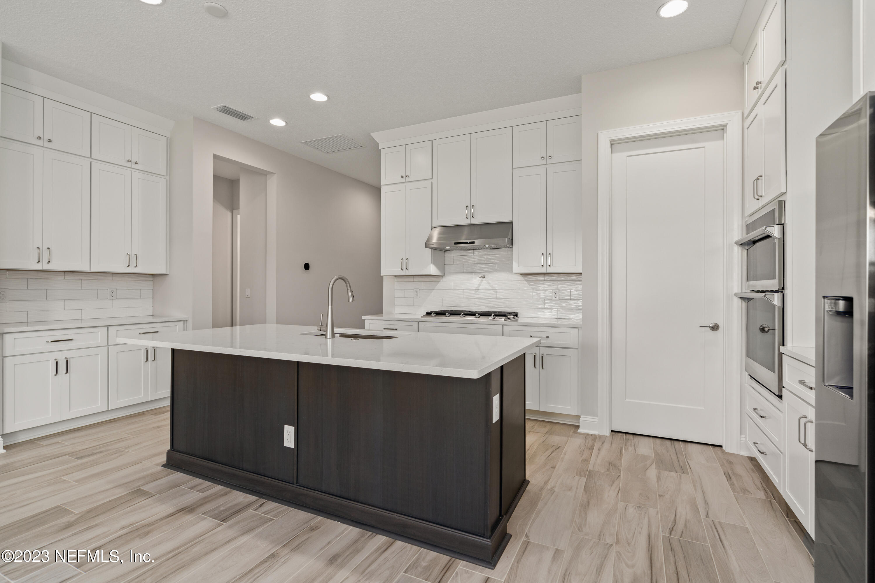 78 Clearview Drive St. Augustine, FL 32092 - Photo 6 of 61 a kitchen with a sink cabinets stainless steel appliances and a window