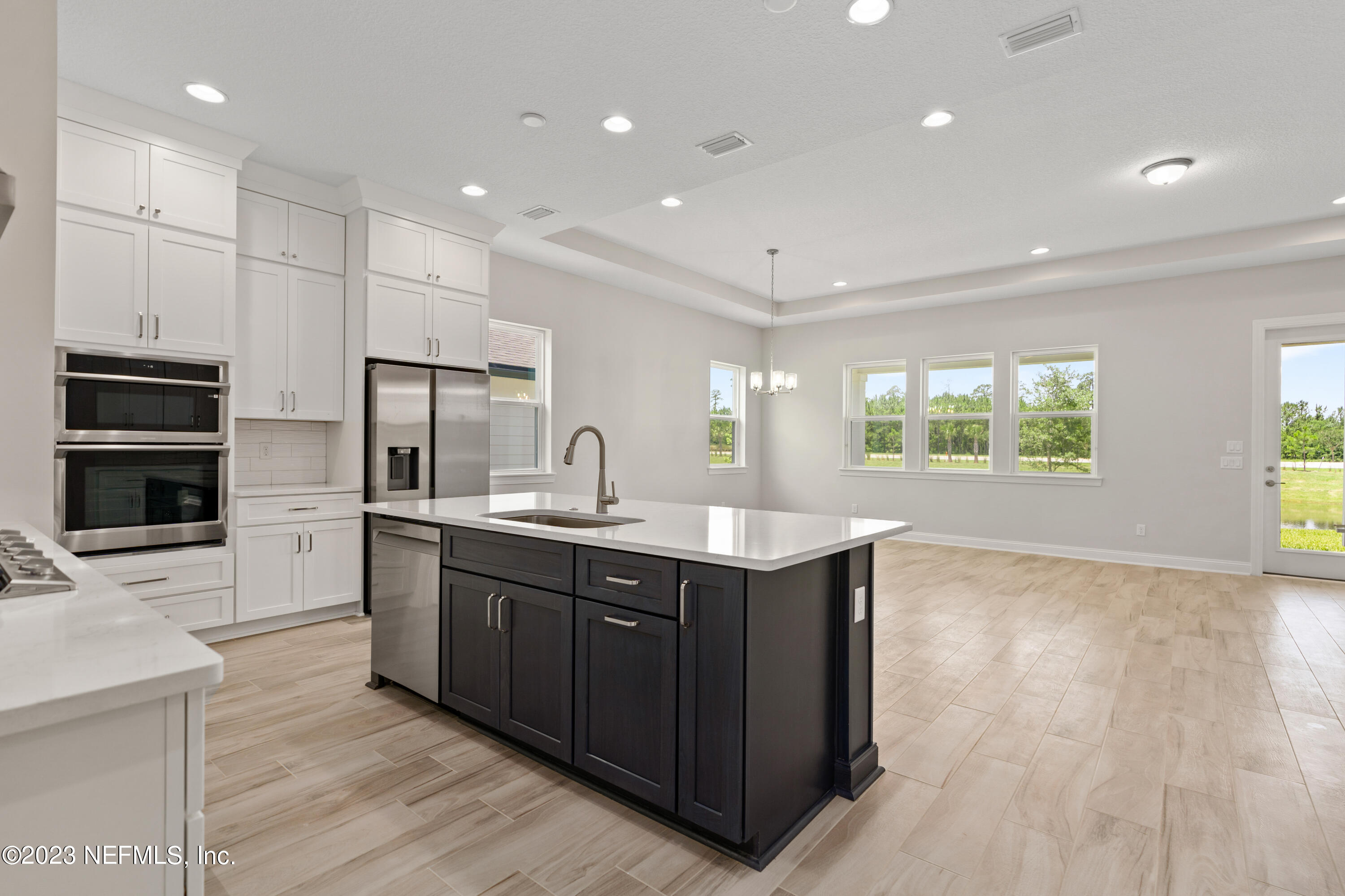 78 Clearview Drive St. Augustine, FL 32092 - Photo 8 of 61 a kitchen with kitchen island granite countertop a sink stainless steel appliances and cabinets