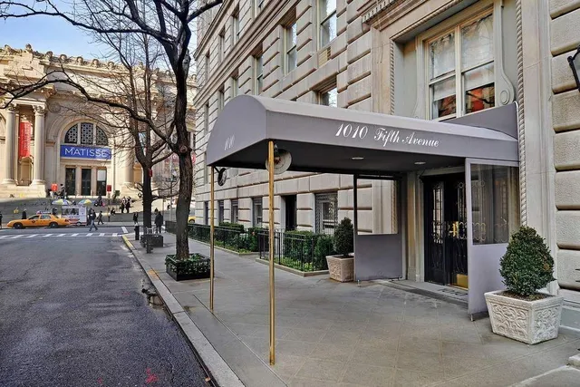 a bathroom with a granite countertop shower a mirror and a sink
