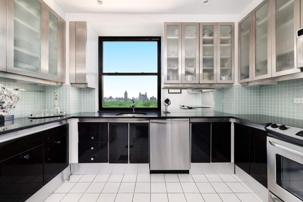 1010 5th Avenue, Unit 12F Manhattan, NY 10028 - Photo 8 of 17 a kitchen with a sink and a stove