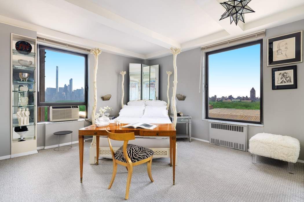 1010 5th Avenue, Unit 12F Manhattan, NY 10028 - Photo 9 of 17 a dining room with furniture and a large window