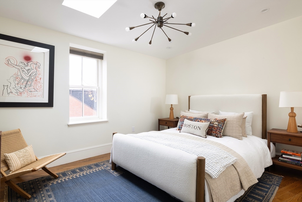 251 Shawmut Avenue, Unit 2 Boston, MA 02118 - Photo 17 of 21 a bedroom with a bed and a window