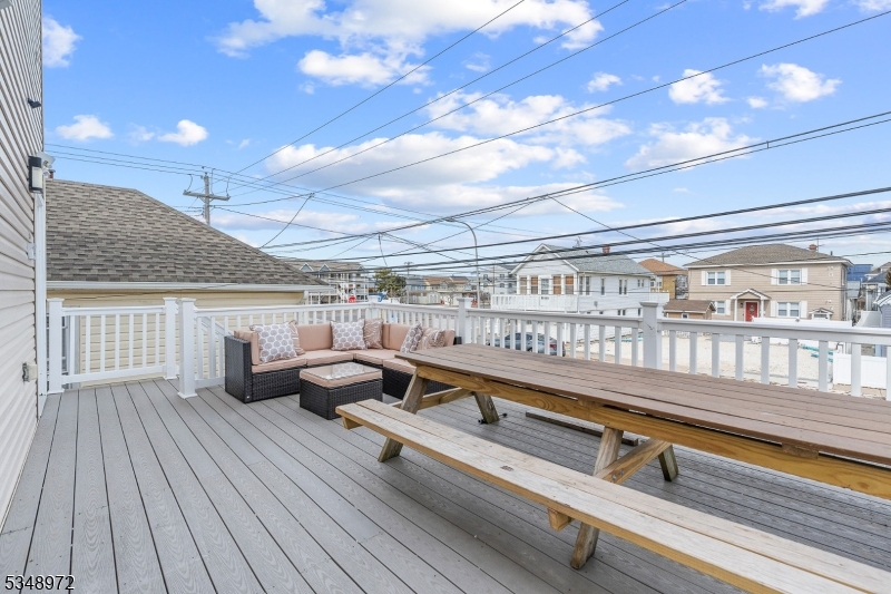 129 Franklin Avenue, Unit A Seaside Heights, NJ 08751 - Photo 11 of 14 a roof deck with couch and chairs