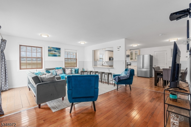 129 Franklin Avenue, Unit A Seaside Heights, NJ 08751 - Photo 2 of 14 a living room with furniture and a flat screen tv