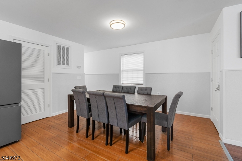 129 Franklin Avenue, Unit A Seaside Heights, NJ 08751 - Photo 5 of 14 a view of a dining room with furniture and wooden floor