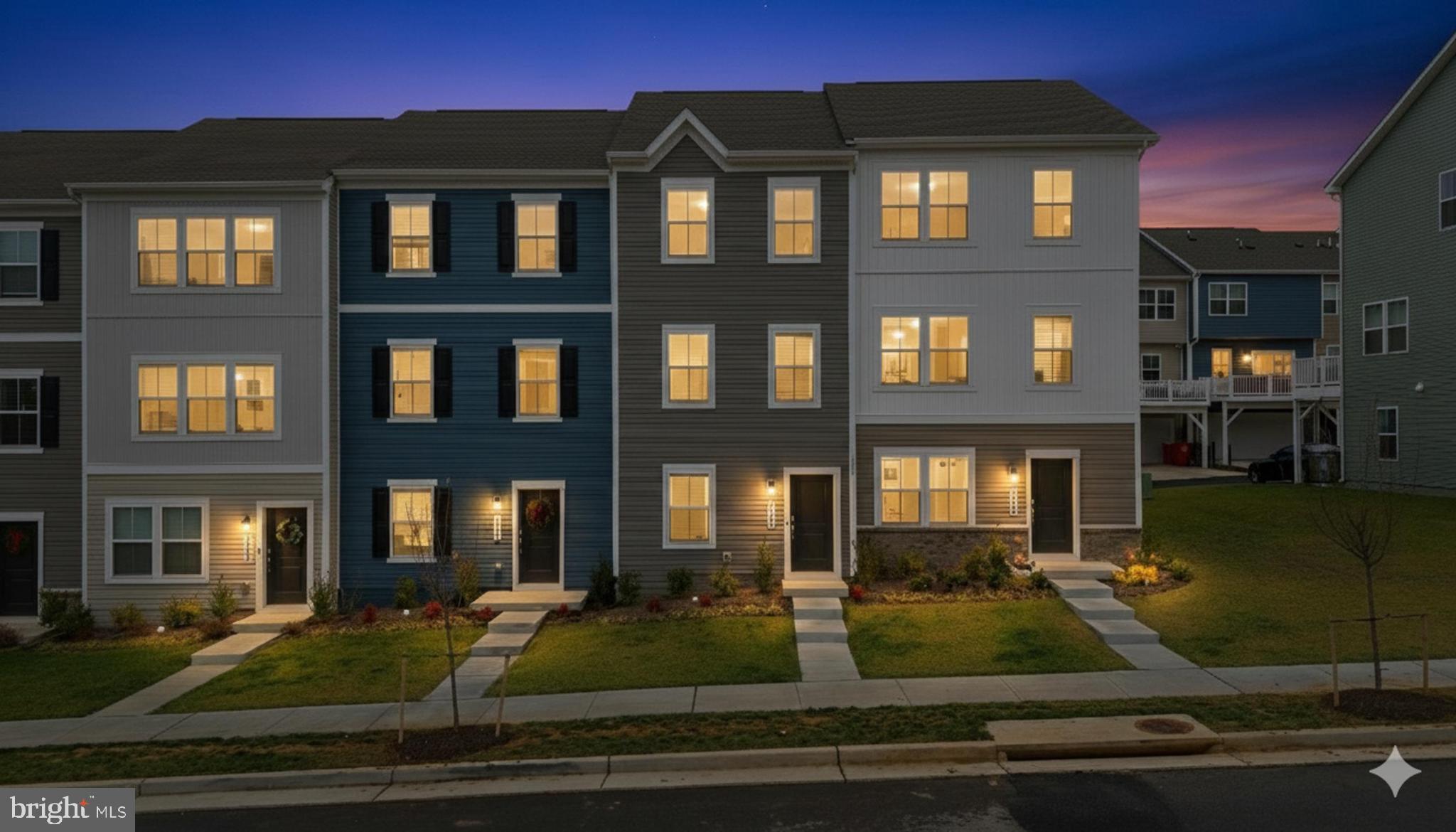 336 Mineral Springs Road Ranson, WV 25438 - Photo 1 of 38 Charming townhomes aglow at twilight.