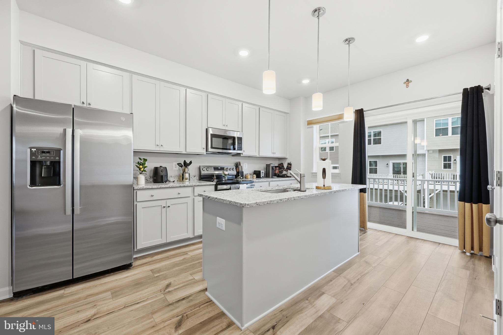 336 Mineral Springs Road Ranson, WV 25438 - Photo 11 of 38 Modern kitchen with sleek finishes and light.