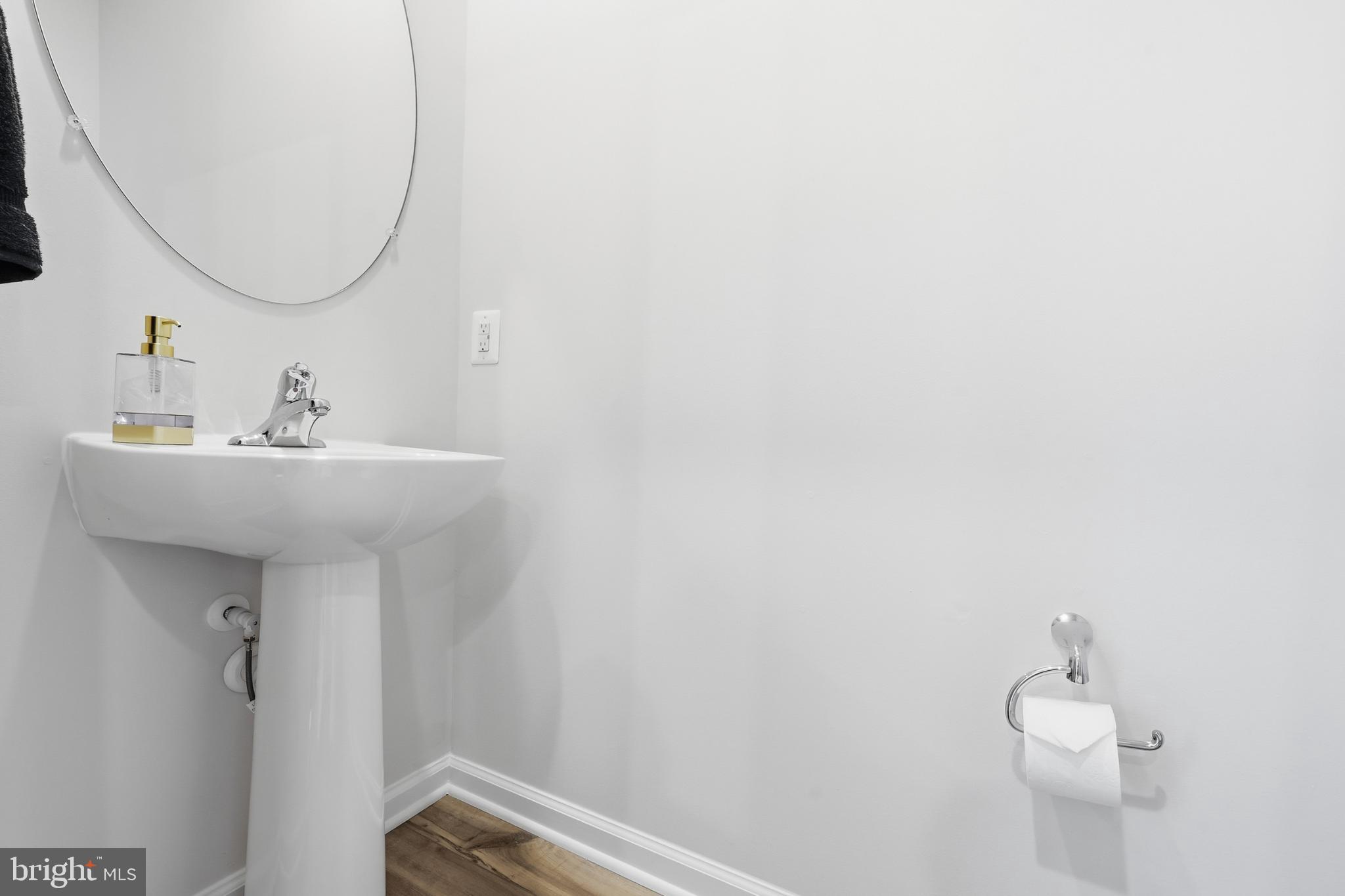 336 Mineral Springs Road Ranson, WV 25438 - Photo 15 of 38 Sleek and modern powder room design.