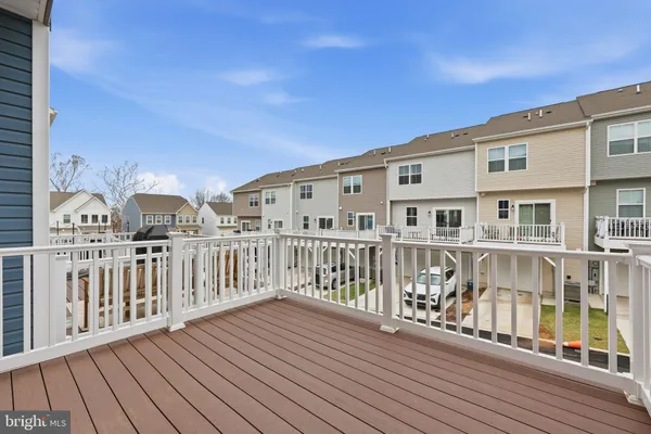 a view of a house with wooden deck