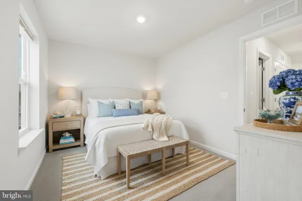 a bedroom with a bed and a table