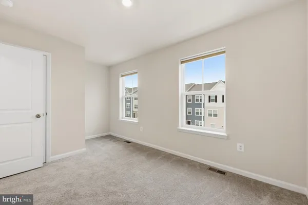 a view of a hallway with white walls