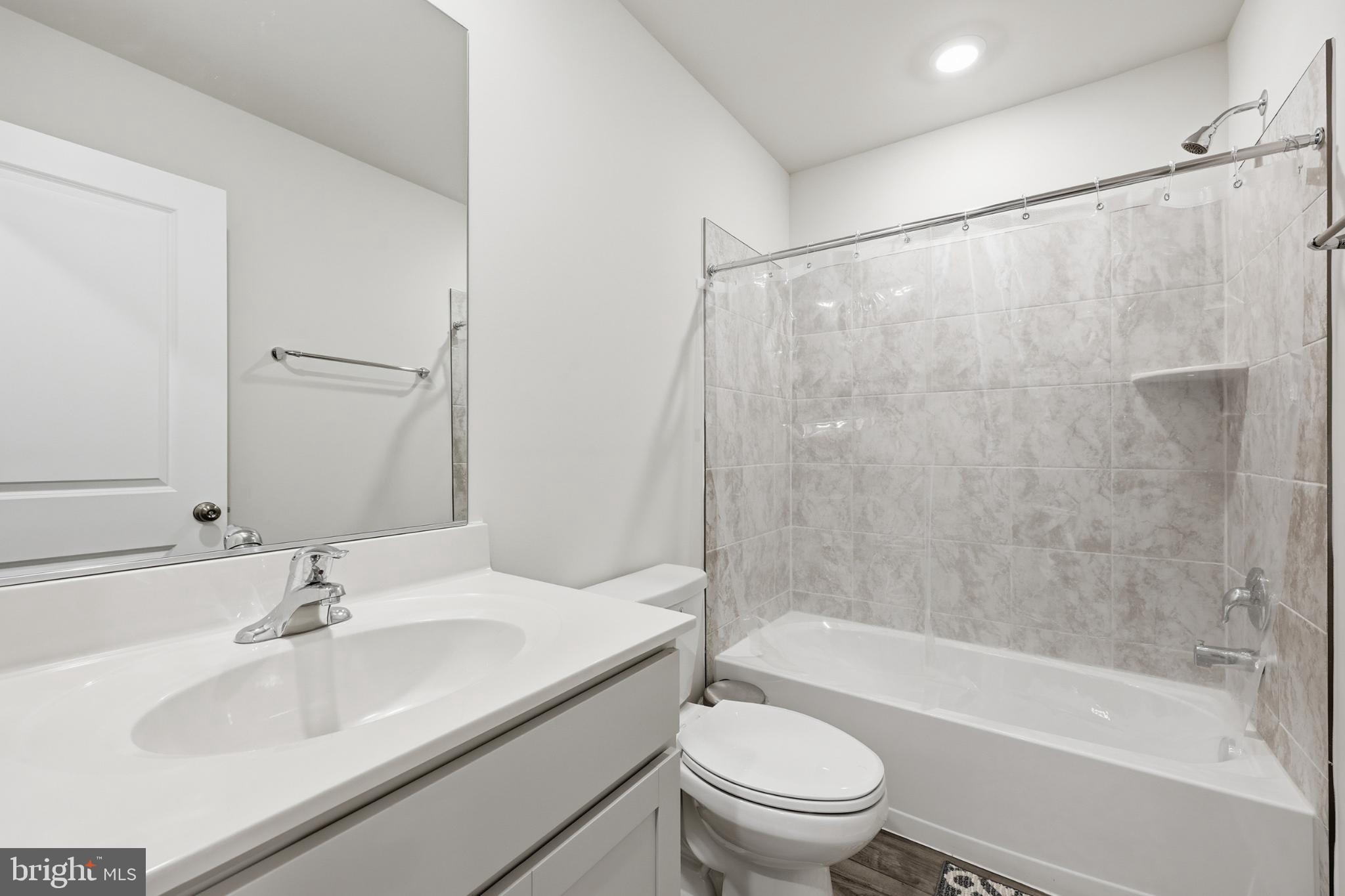 336 Mineral Springs Road Ranson, WV 25438 - Photo 27 of 41 a bathroom with a granite countertop sink toilet and shower
