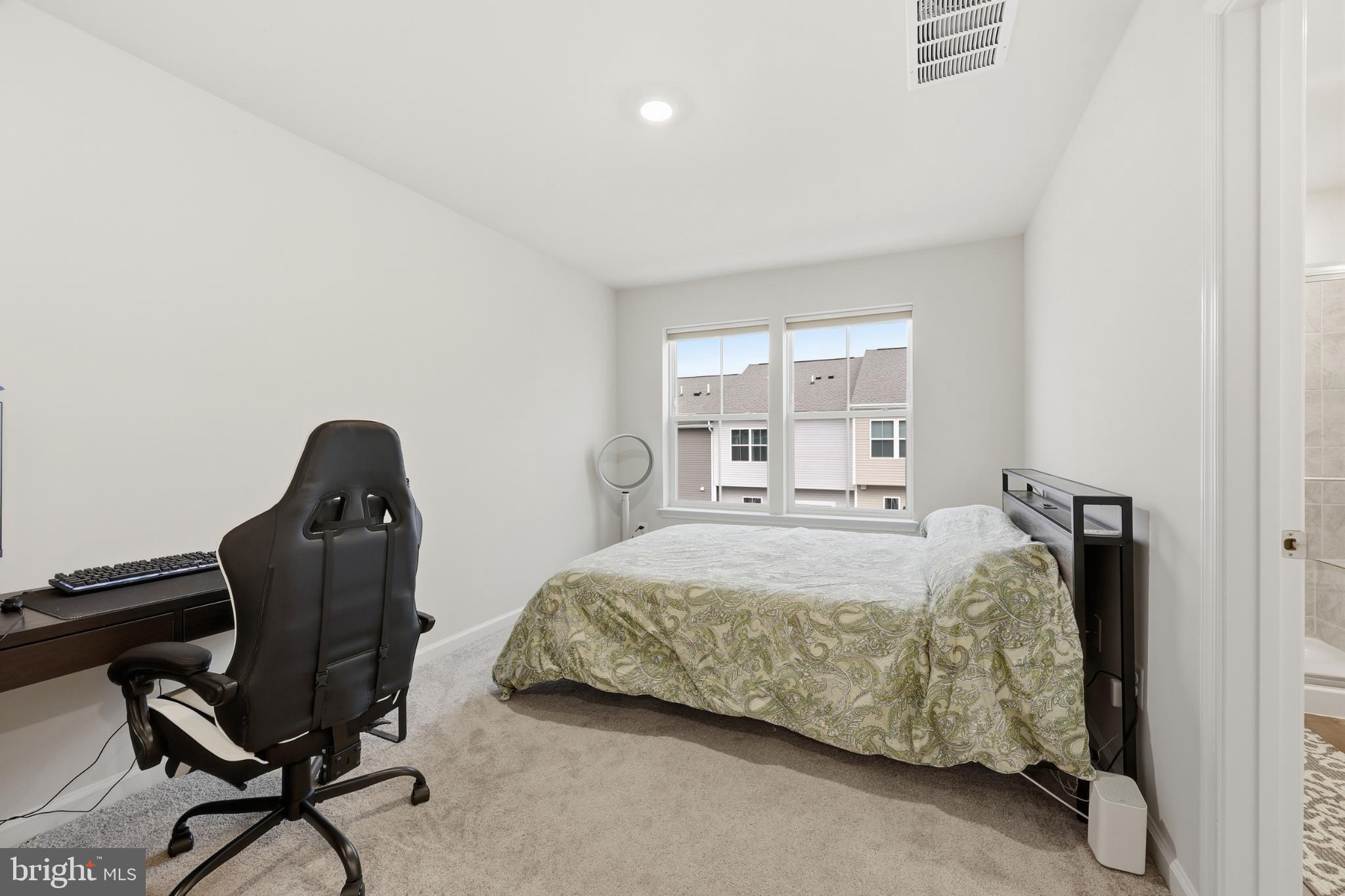 336 Mineral Springs Road Ranson, WV 25438 - Photo 28 of 38 Bright and airy bedroom with modern charm.