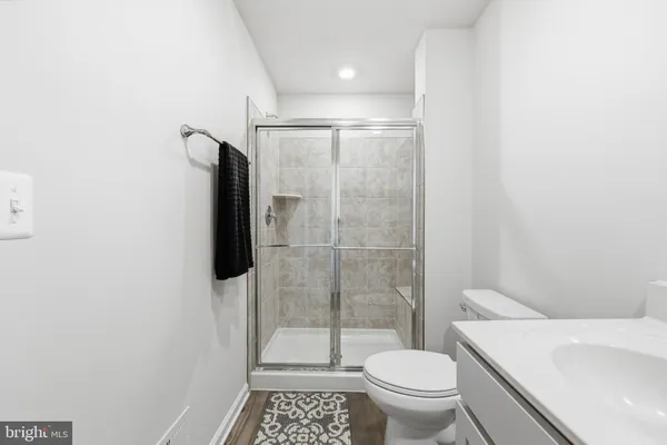 a bedroom with a bed and a chair