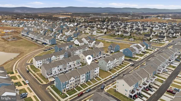 an aerial view of residential building and car parked