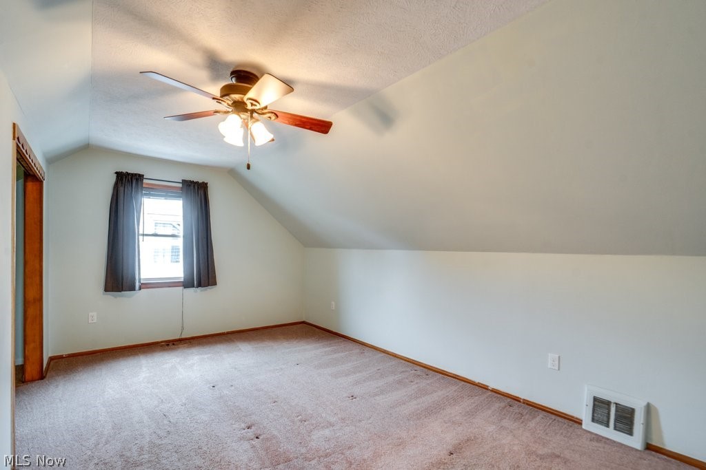 30000 Elgin Road Wickliffe, OH 44092 - Photo 17 of 30 Carpeted room featuring an angled ceiling and a ceiling fan with integrated lighting