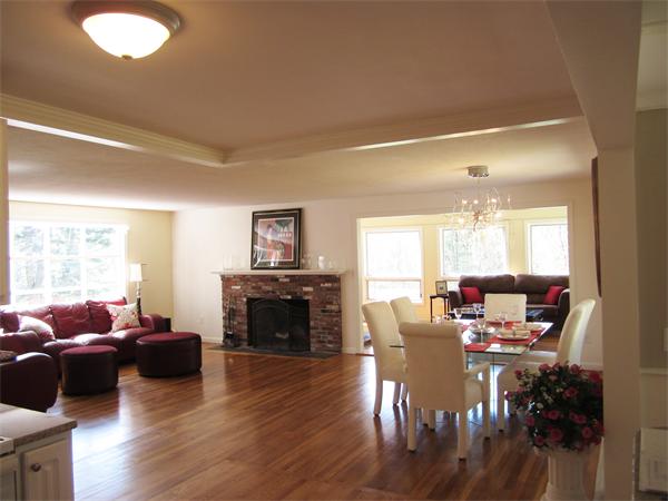 24 Whitcomb Road Bolton, MA 01740 - Photo 8 of 20 a living room with furniture flat screen tv and a fireplace