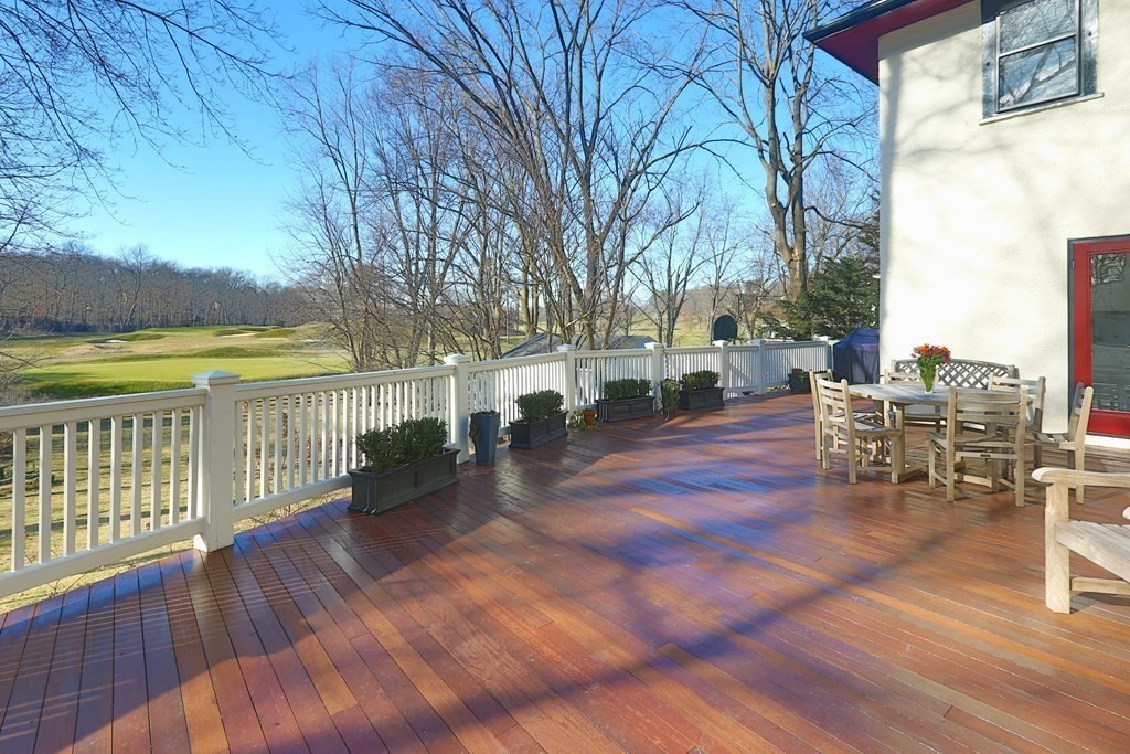40 Windsor Road Newton, MA 02468 - Photo 12 of 29 a view of a patio with dining table and chairs with wooden floor