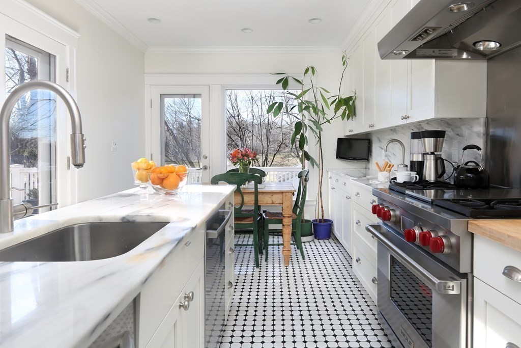 40 Windsor Road Newton, MA 02468 - Photo 10 of 29 a kitchen with granite countertop a sink a stove and cabinets