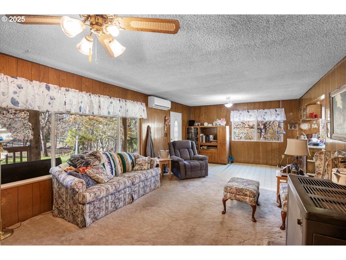 3620 Happy Valley Road Roseburg, OR 97471 - Photo 3 of 25 a living room with furniture and a large window