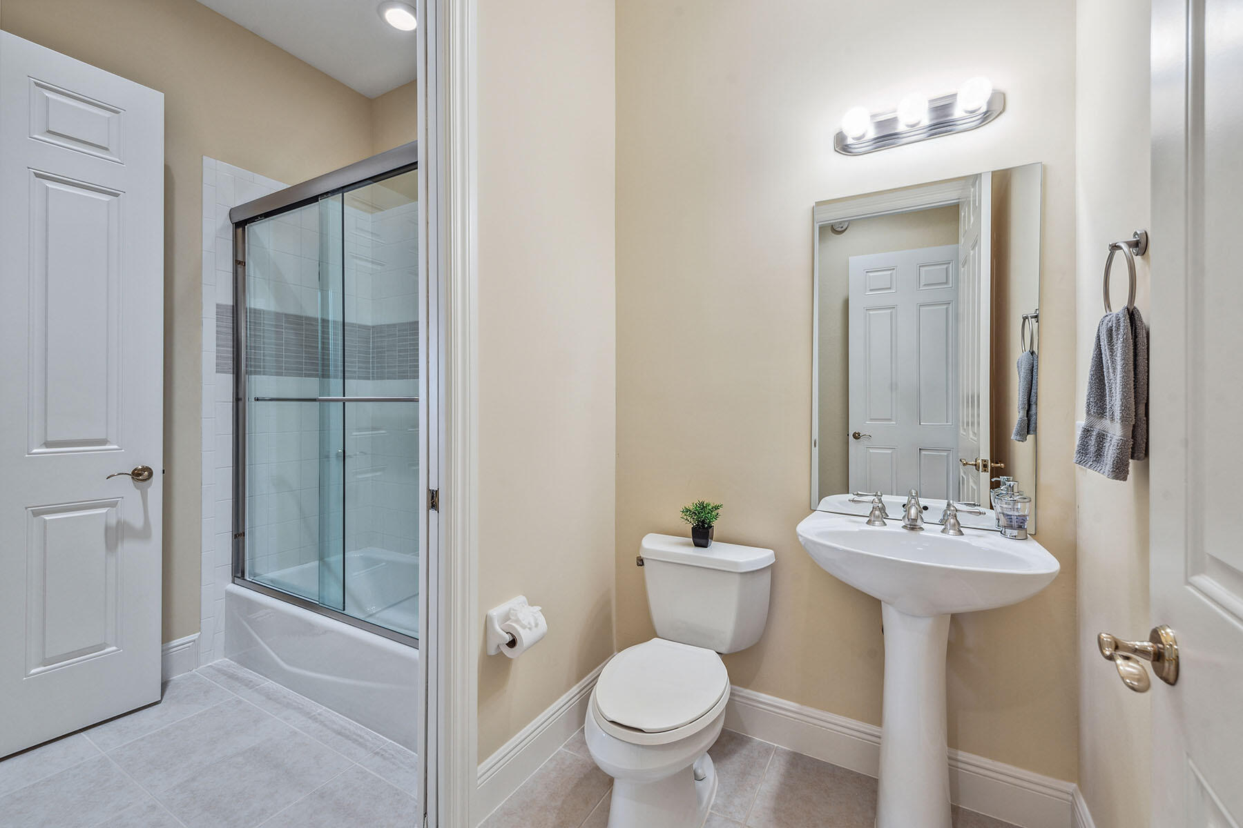 3189 Aviamar Circle, Unit 202 Naples, FL 34114 - Photo 19 of 50 a bathroom with a sink toilet and mirror