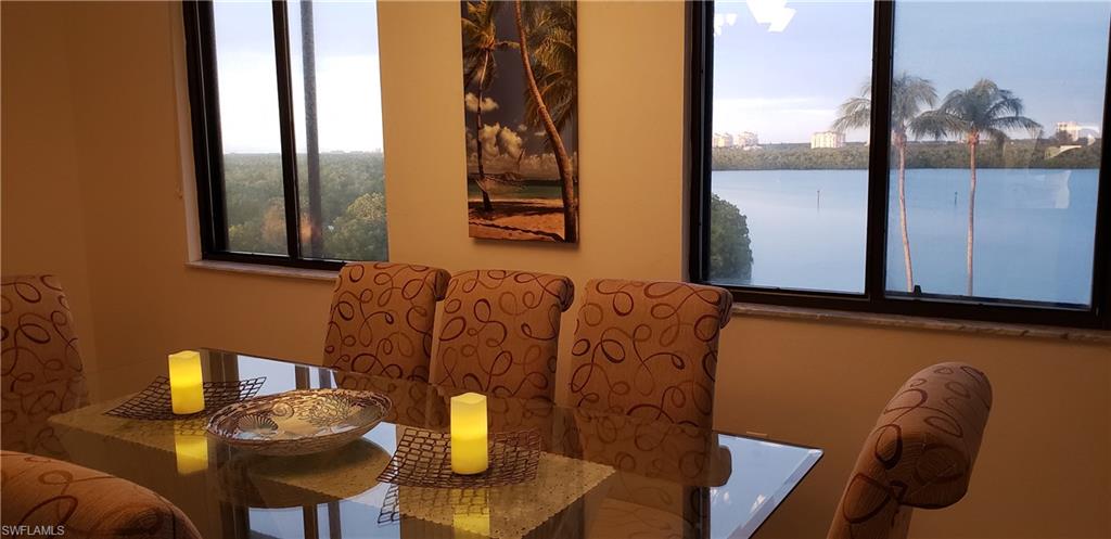 15 Bluebill Avenue, Unit 406 Naples, FL 34108 - Photo 12 of 18 a view of balcony and chair