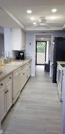 a large kitchen with a window
