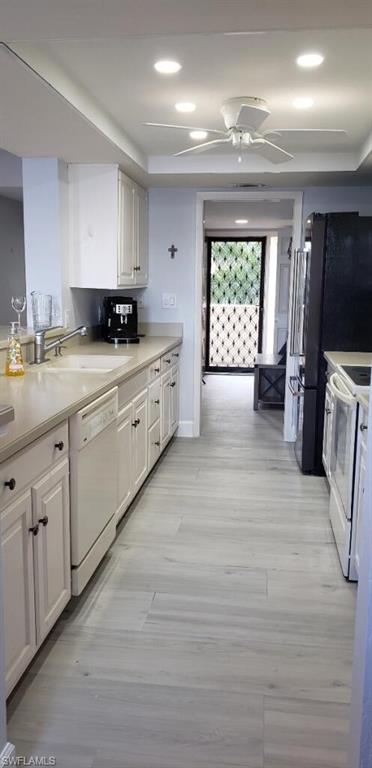 15 Bluebill Avenue, Unit 406 Naples, FL 34108 - Photo 7 of 18 a large kitchen with a window