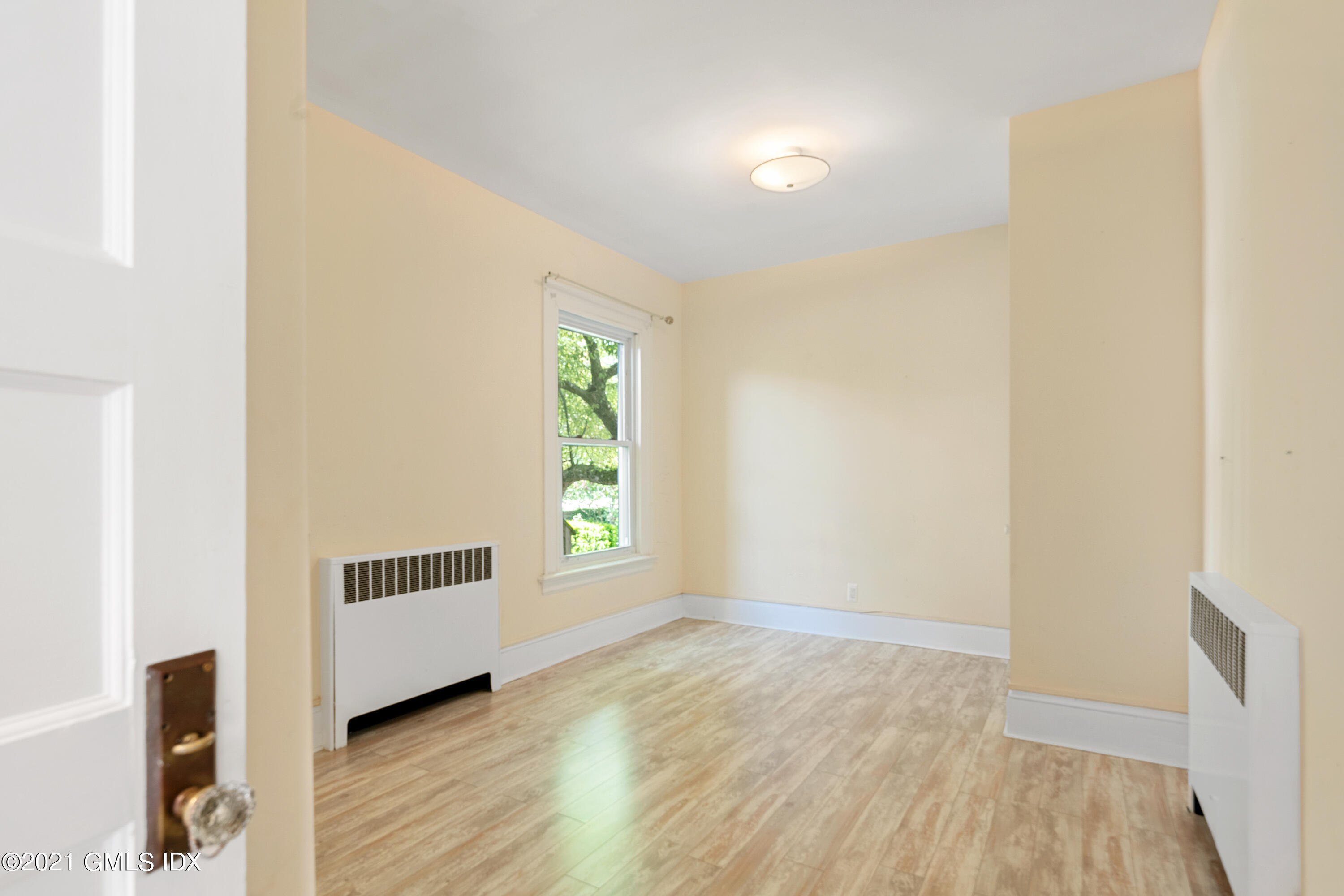 14 Byram Shore Road Greenwich, CT 06830 - Photo 16 of 47 a view of an empty room and window