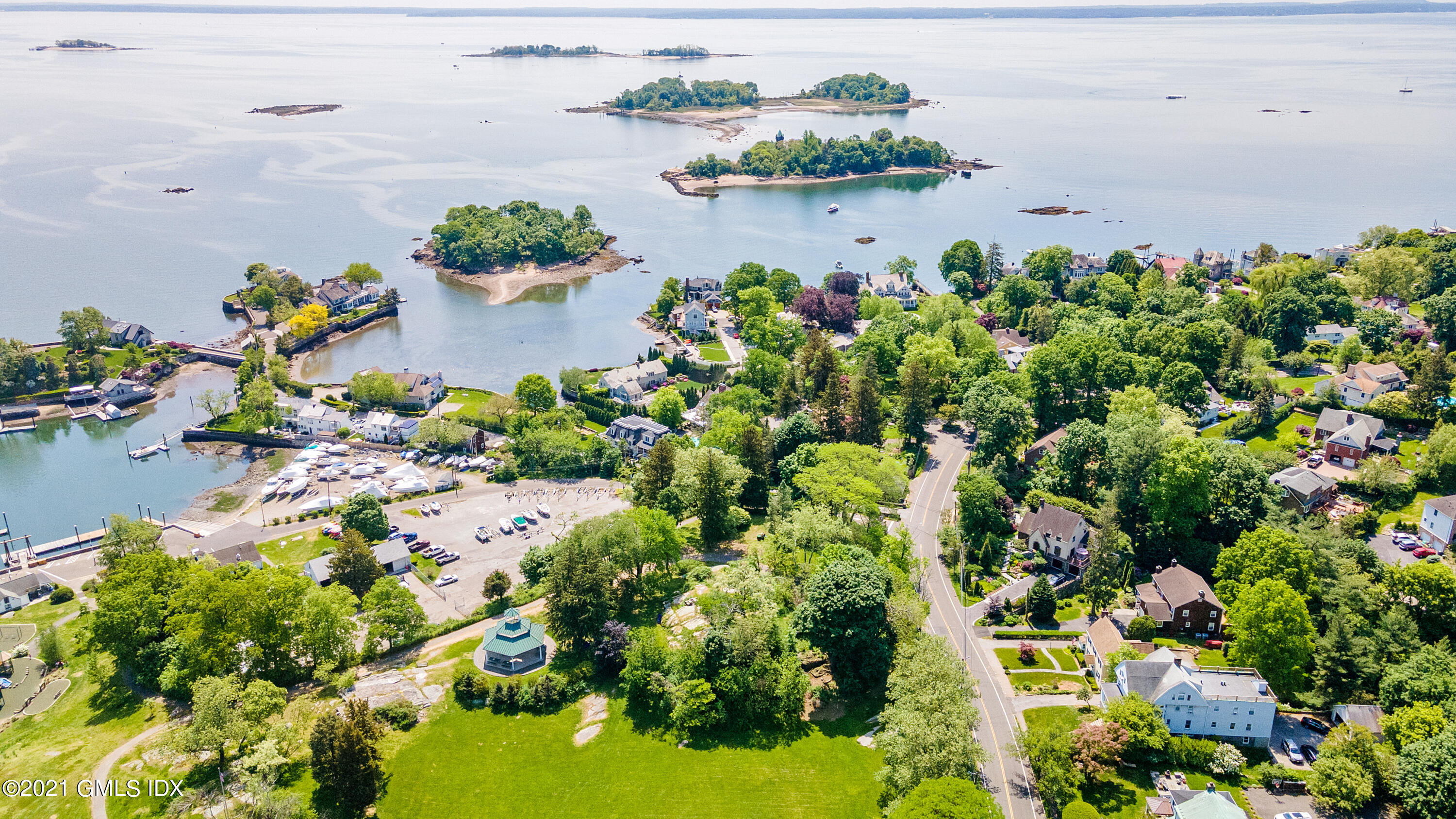 14 Byram Shore Road Greenwich, CT 06830 - Photo 2 of 47 an aerial view of a house with a yard and lake view