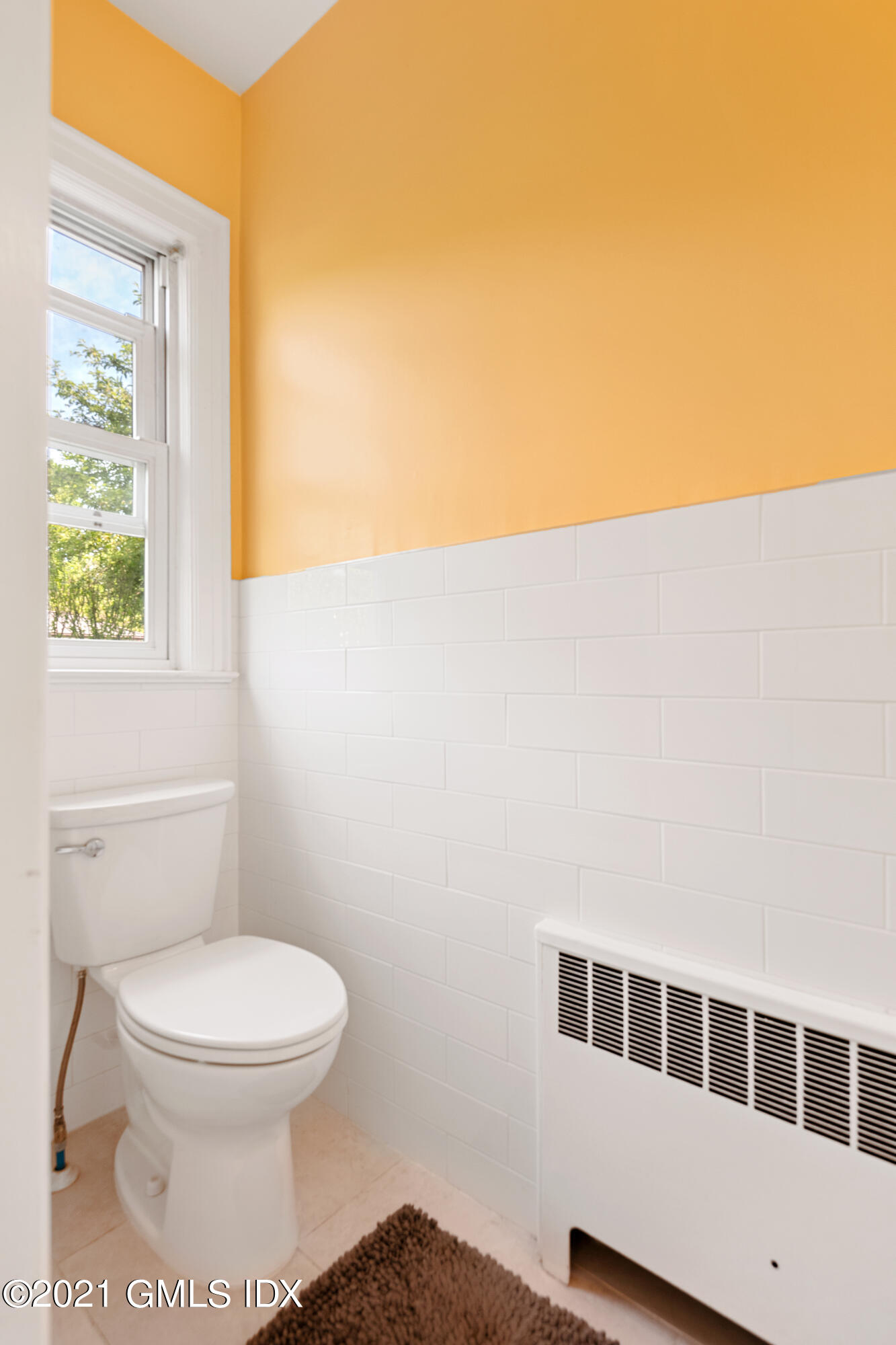 14 Byram Shore Road Greenwich, CT 06830 - Photo 22 of 47 a bathroom with a toilet and a window