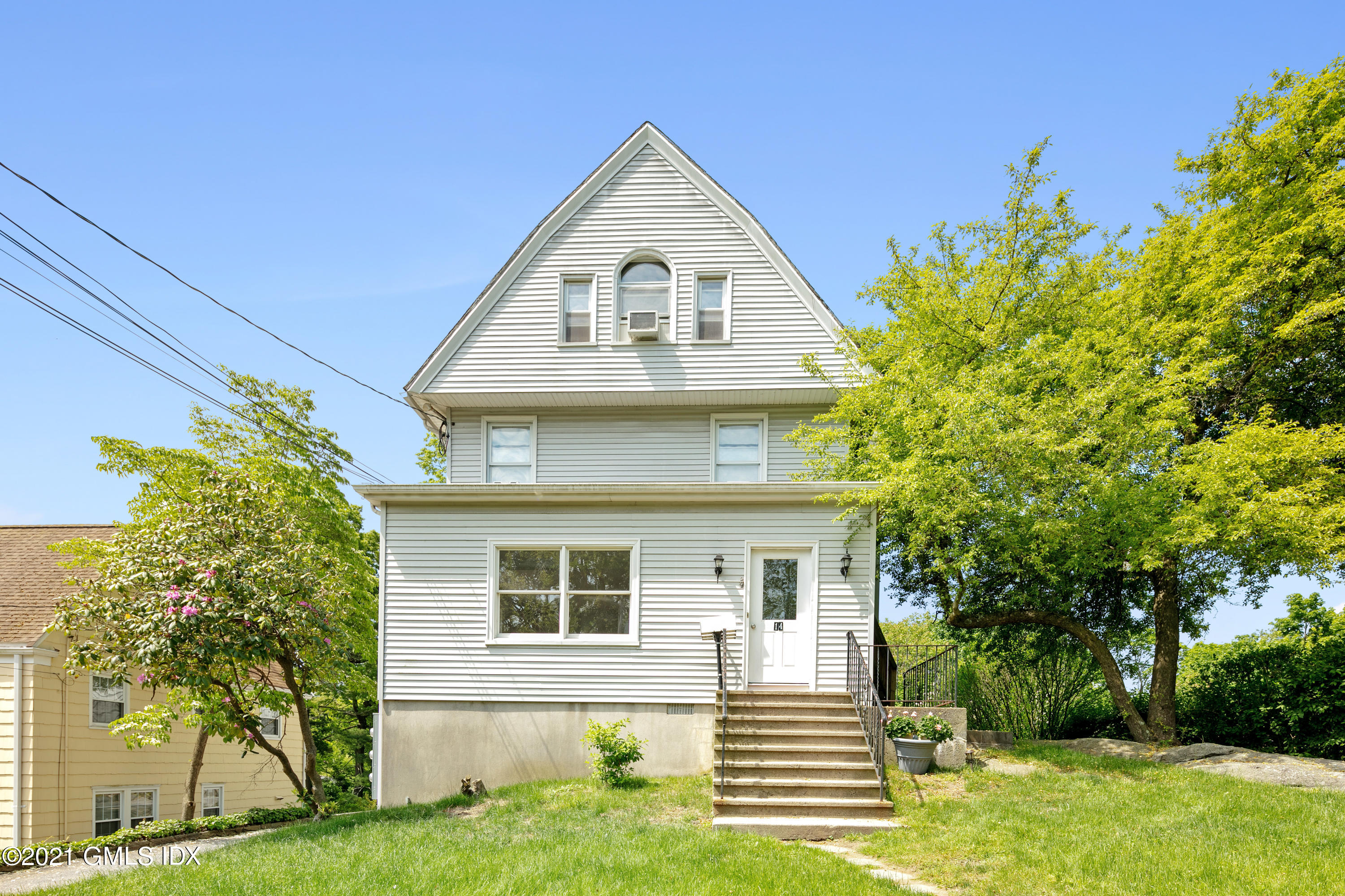 14 Byram Shore Road Greenwich, CT 06830 - Photo 31 of 47 a view of a house with a yard