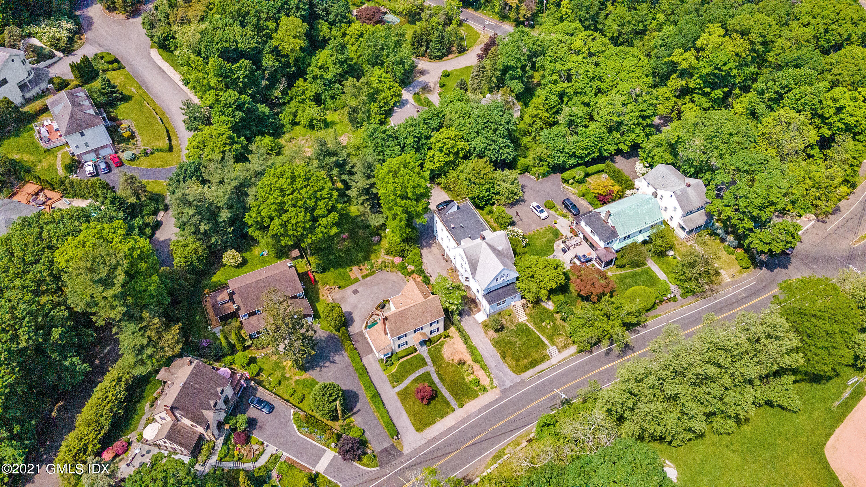 14 Byram Shore Road Greenwich, CT 06830 - Photo 38 of 47 an aerial view of a house with a yard