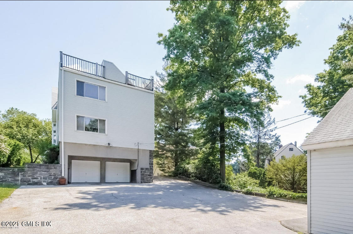 14 Byram Shore Road Greenwich, CT 06830 - Photo 42 of 47 a house that has a tree in front of it