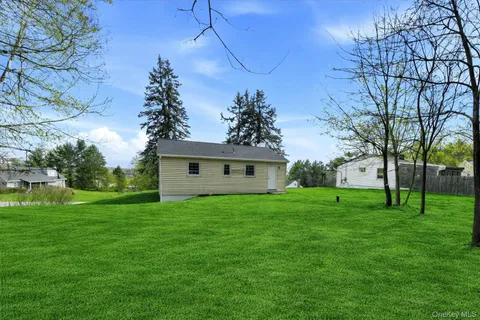 a view of a backyard of the house