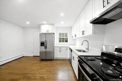 a kitchen with a stove and a refrigerator