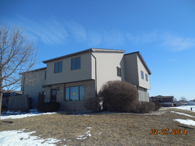 774 Lake Road New Lenox, IL 60451 - Photo 1 of 14 a view of a house with a yard