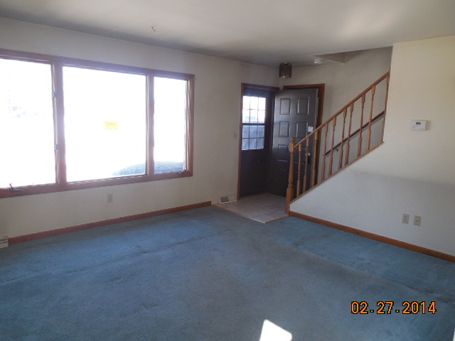 774 Lake Road New Lenox, IL 60451 - Photo 4 of 14 an empty room with windows