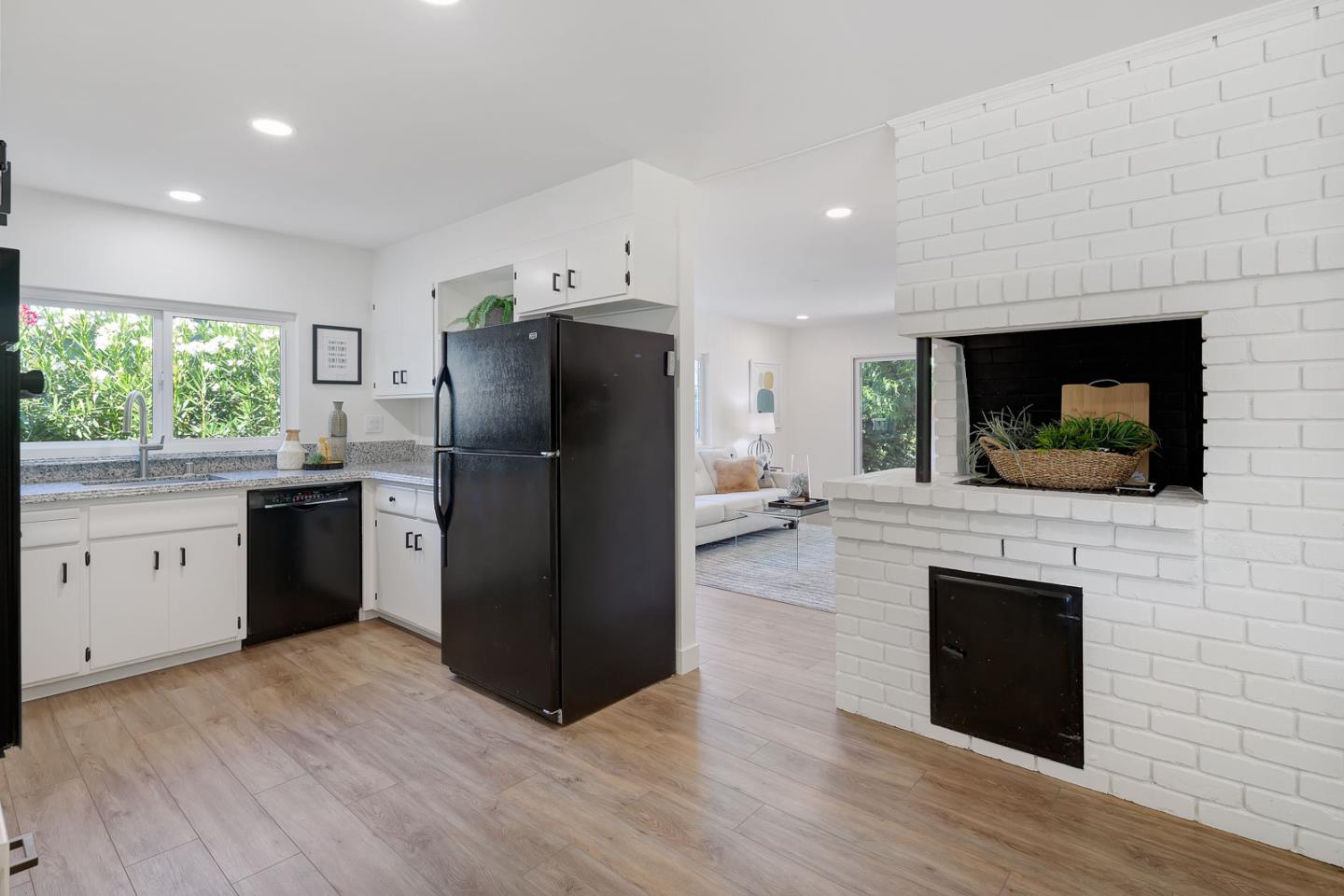 1650 Manitoba Drive Sunnyvale, CA 94087 - Photo 11 of 26 a kitchen with a refrigerator stove and wooden floor