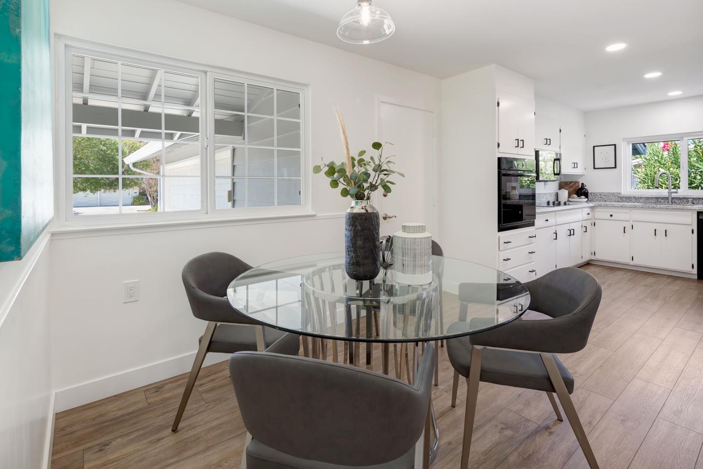 1650 Manitoba Drive Sunnyvale, CA 94087 - Photo 13 of 26 a view of a dining room with furniture and wooden floor
