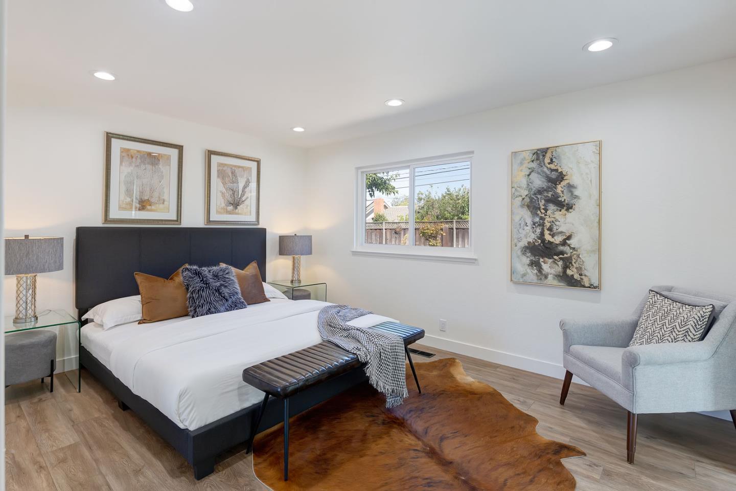 1650 Manitoba Drive Sunnyvale, CA 94087 - Photo 14 of 26 a bedroom with a bed and a couch