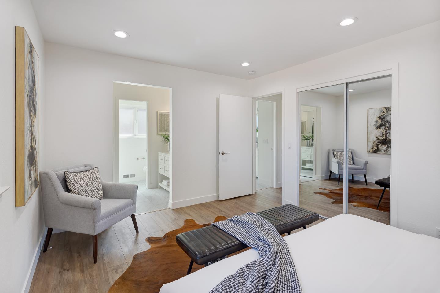 1650 Manitoba Drive Sunnyvale, CA 94087 - Photo 15 of 26 a bedroom with a bed and a couch