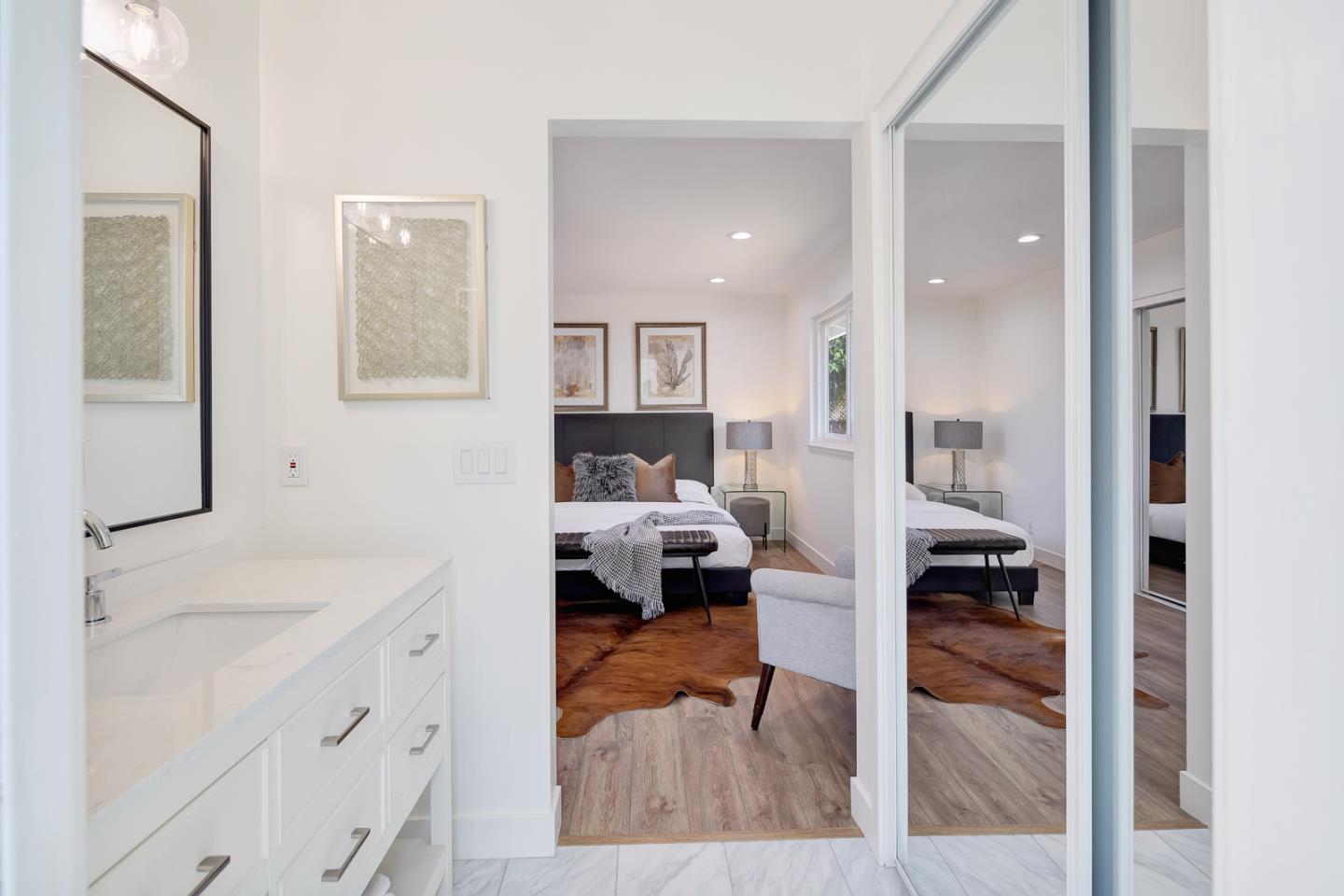1650 Manitoba Drive Sunnyvale, CA 94087 - Photo 17 of 26 a en suite bathroom with a sink and a mirror