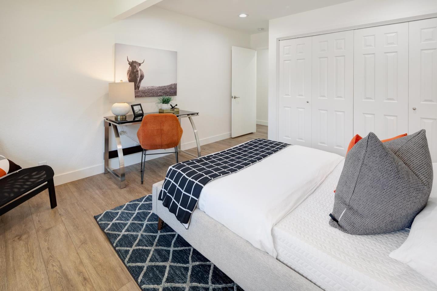 1650 Manitoba Drive Sunnyvale, CA 94087 - Photo 19 of 26 a bedroom with a bed and wooden floor